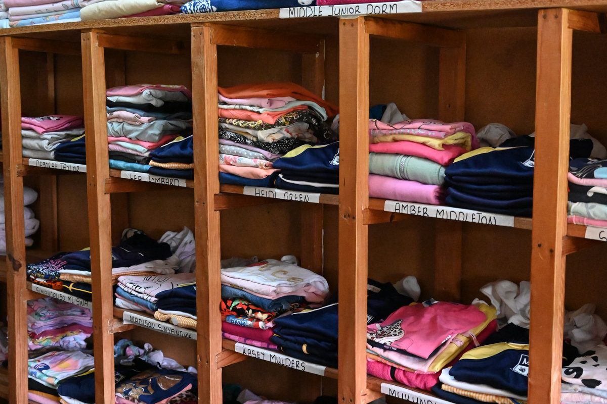 Cubbies with folded clothes