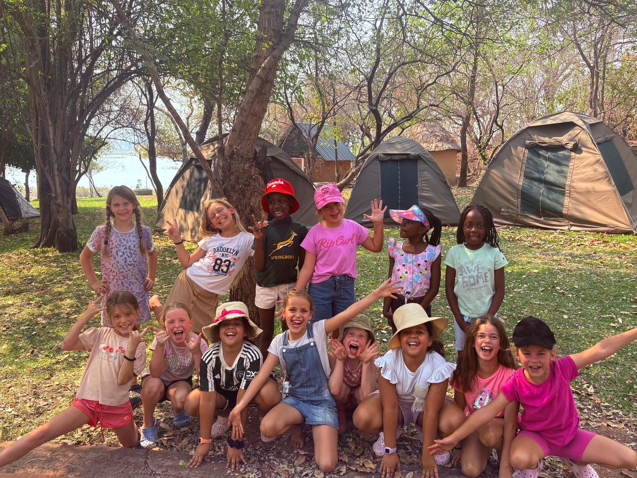 Grade 3 pupils outside their tents at Lotri Bay